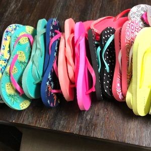 14 pairs of used and new Old Navy flip flops